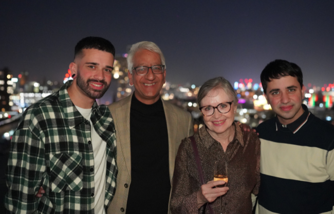 Family photo of Manny on London rooftop at night